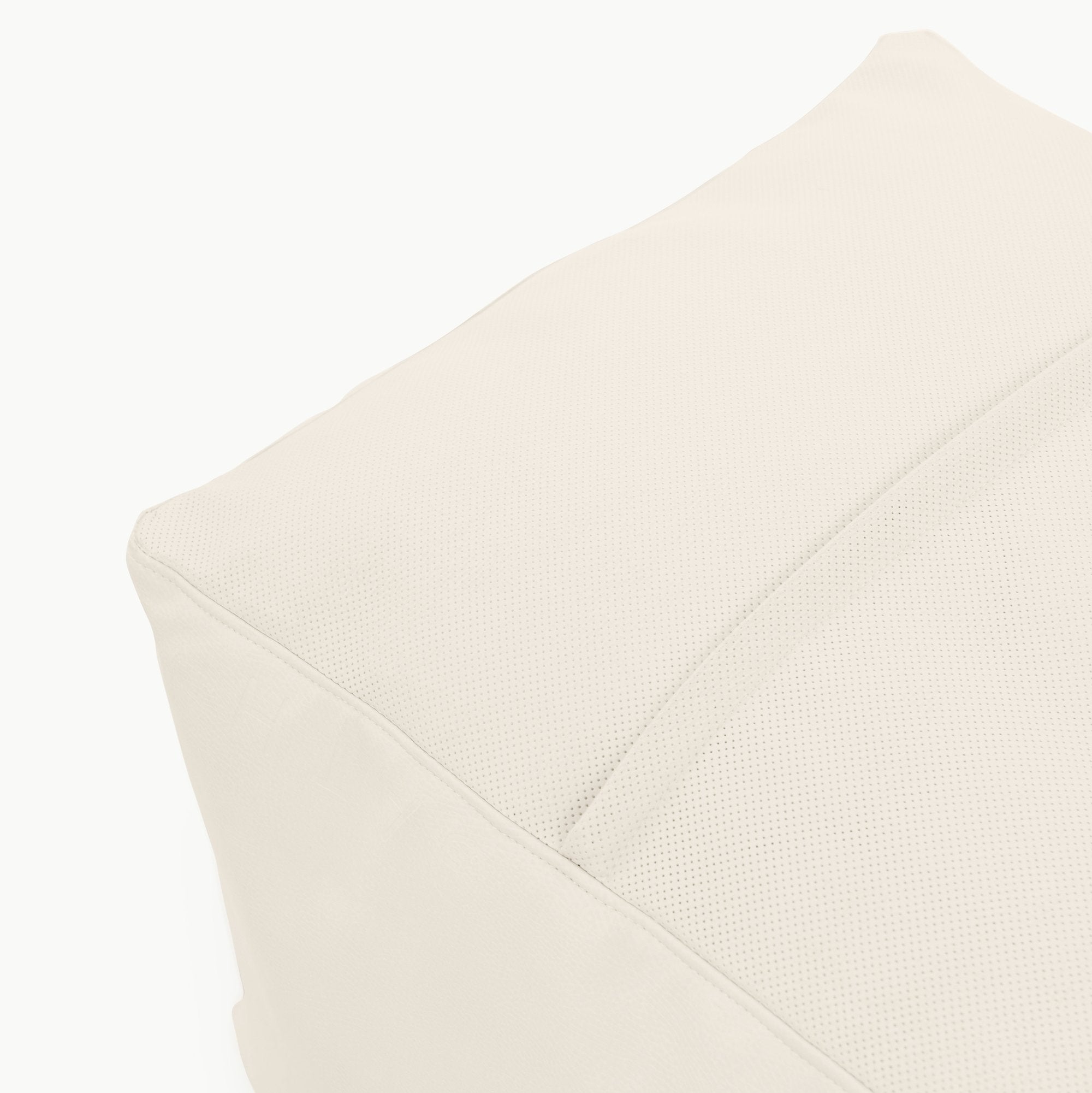 Ivory@Detail shot of perforated side of Ivory Square Pouf  