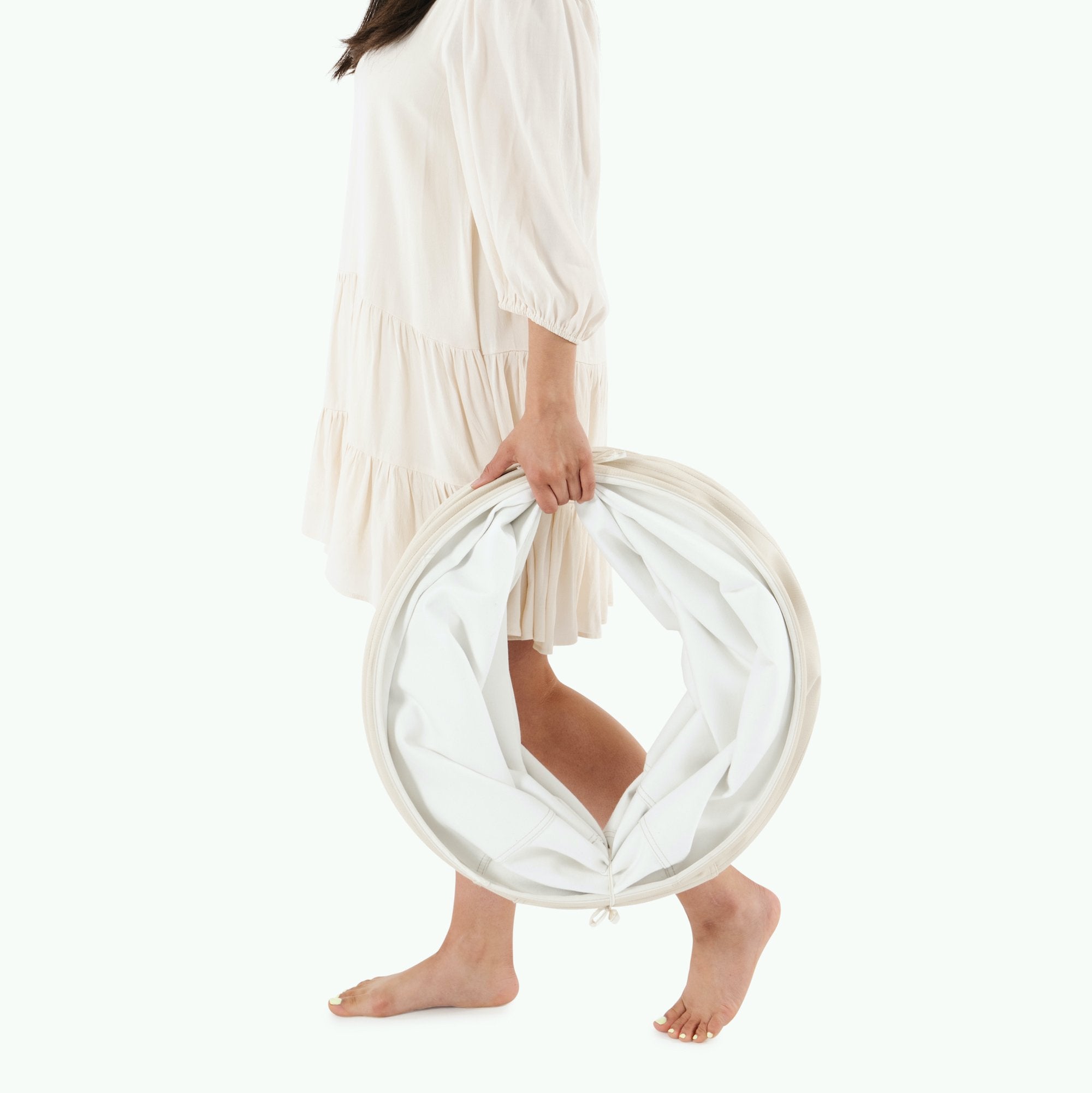 Ivory@Woman holding the folded Ivory Tunnel