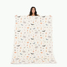 Menagerie (on sale)@Woman holding the Menagerie Midi+ Mat