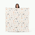 Menagerie (on sale) / Square@Woman holding the Menagerie Midi Square Mat