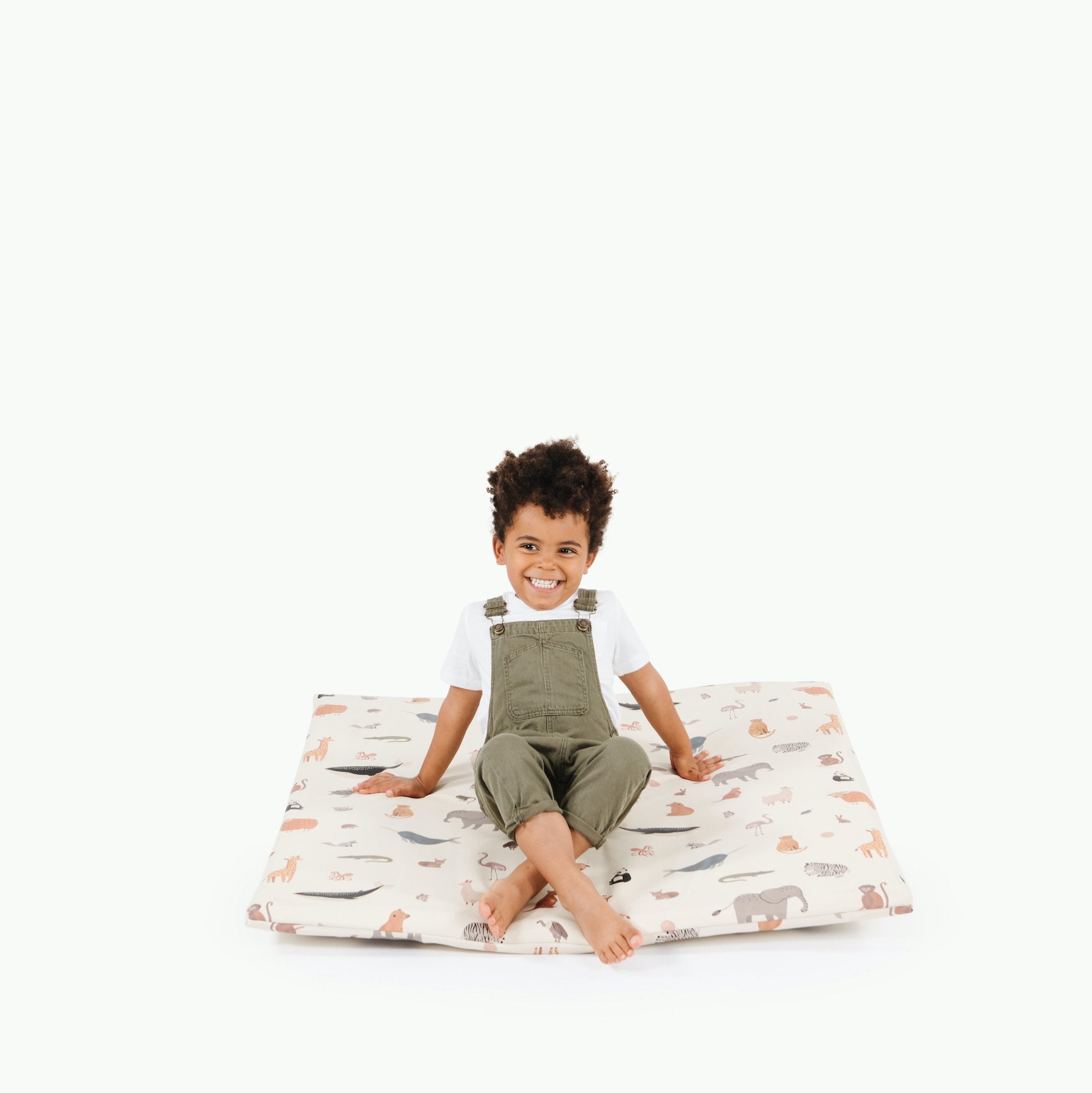 Menagerie (on sale) / Square@Boy sitting on Menagerie Padded Mini Square