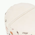 Menagerie (on sale)@Detail shot of perforated side of Menagerie Circle Pouf