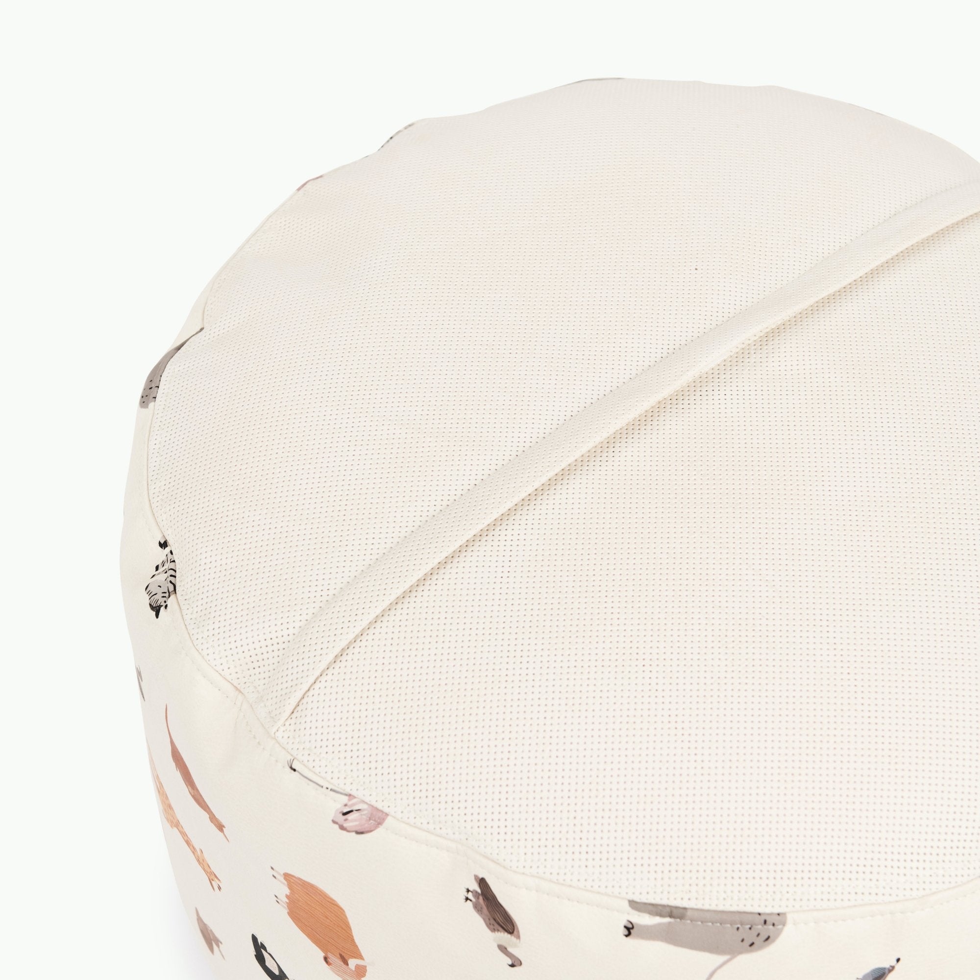 Menagerie (on sale)@Detail shot of perforated side of Menagerie Circle Pouf
