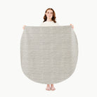 Stone Stripe (on sale) / Circle@Woman holding the Stone Stripe Midi Circle Mat