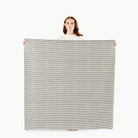 Stone Stripe (on sale) / Square@Woman holding the Stone Stripe Midi Square Mat