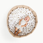 Millet@Child playing in a soft ball pit designed for babies and toddlers