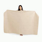 Millet (on sale)@Woman holding the Millet Midi+ Mat