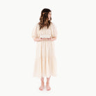 Boulevard@Woman holding a folded Boulevard Mini+ Mat