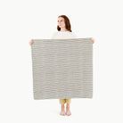 Stone Stripe / Highchair Mat@ Mini (Color) woman holding the mini stone stripe mat