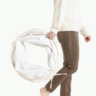 Parchment@Woman holding the folded Parchment Tunnel