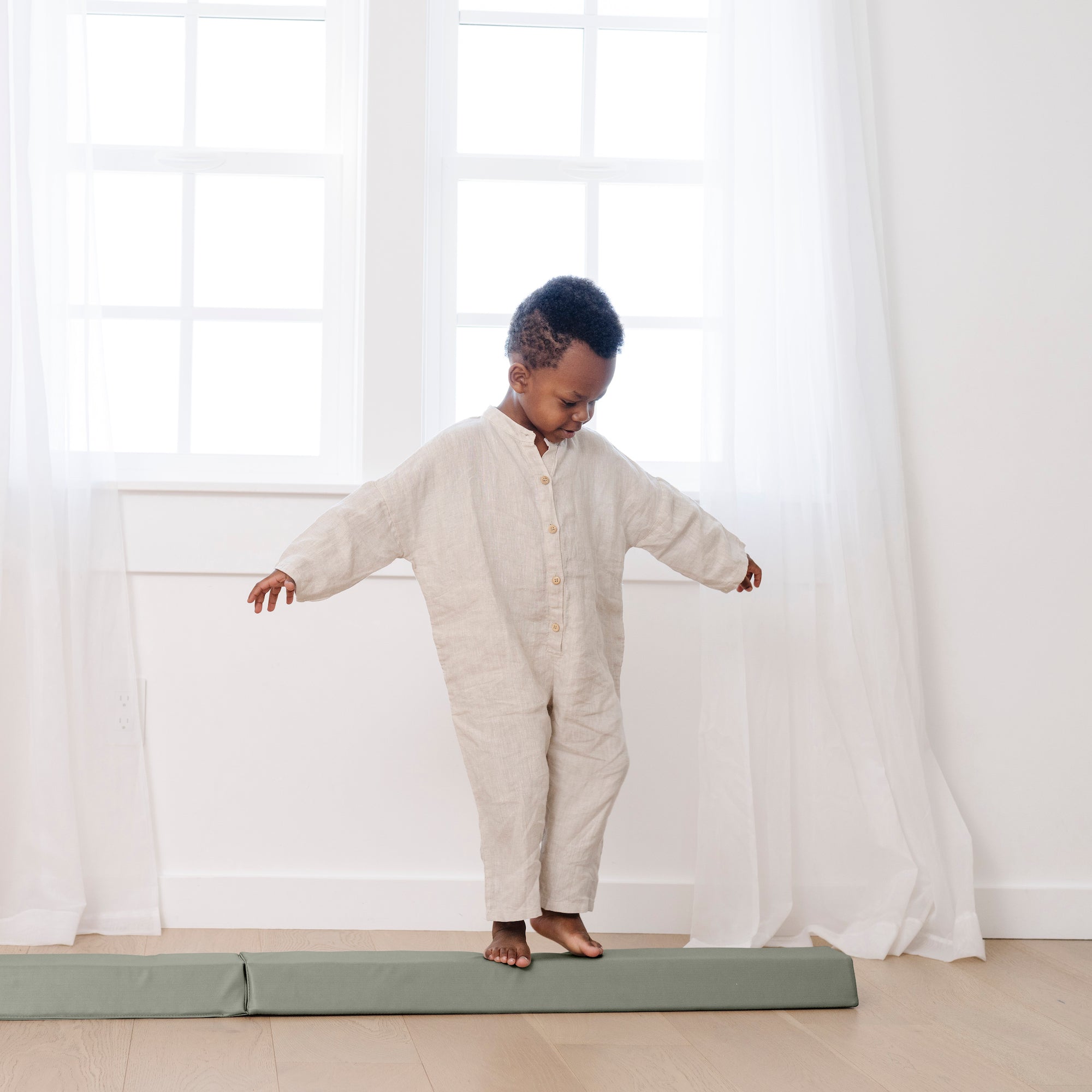 Seagrass (on sale)@kid walking across the rollic by gathre balance beam