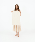 Blanc Scallop (on sale)@Woman holding the Blanc Scallop Micro+ Mat