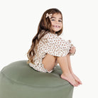 Thyme@Kid sitting on a Thyme Circle Pouf