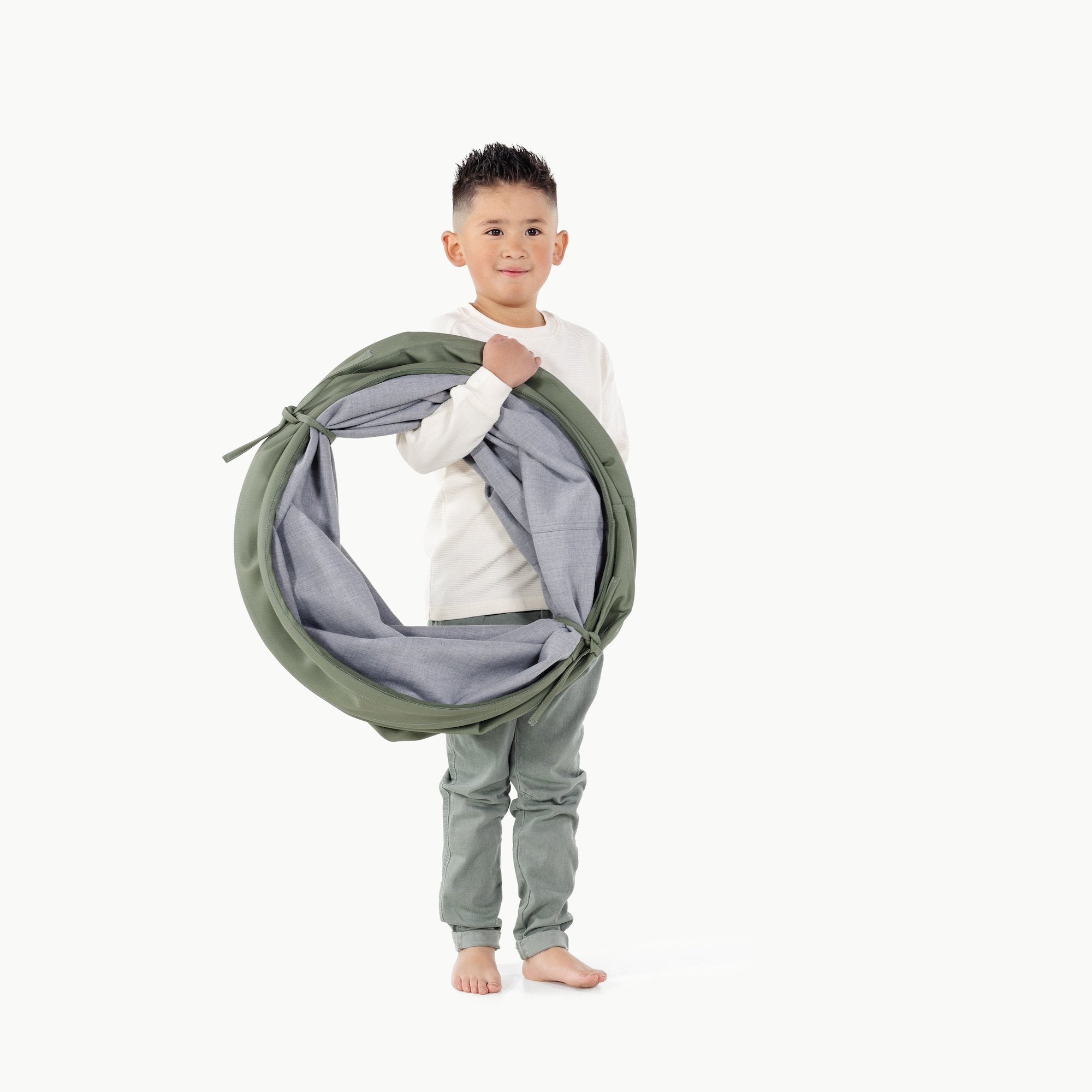 Thyme@Kid holding the Thyme Tunnel folded up