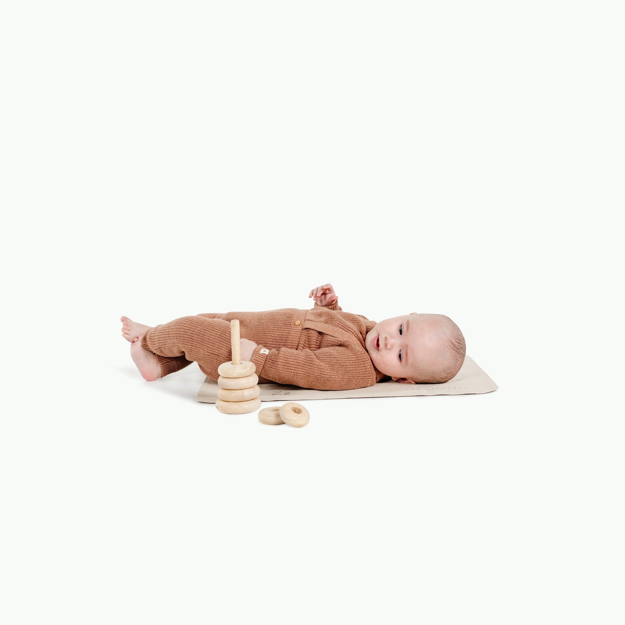 Alphabet@Baby sitting on the Ivory Micro mat