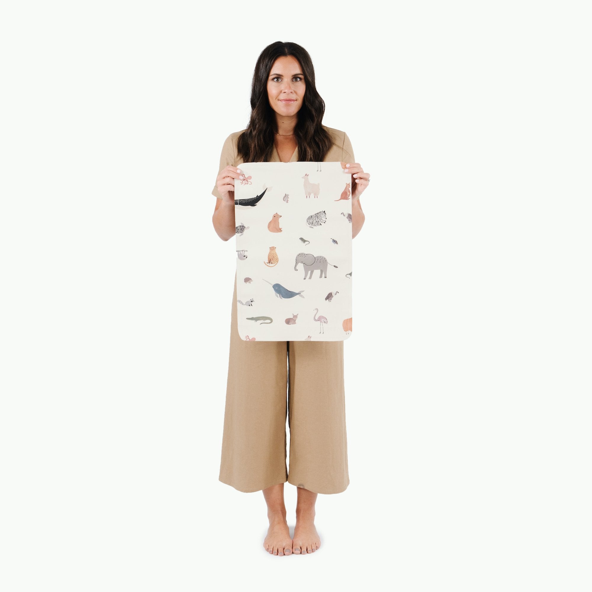 Menagerie@Woman holding the Menagerie Micro mat 